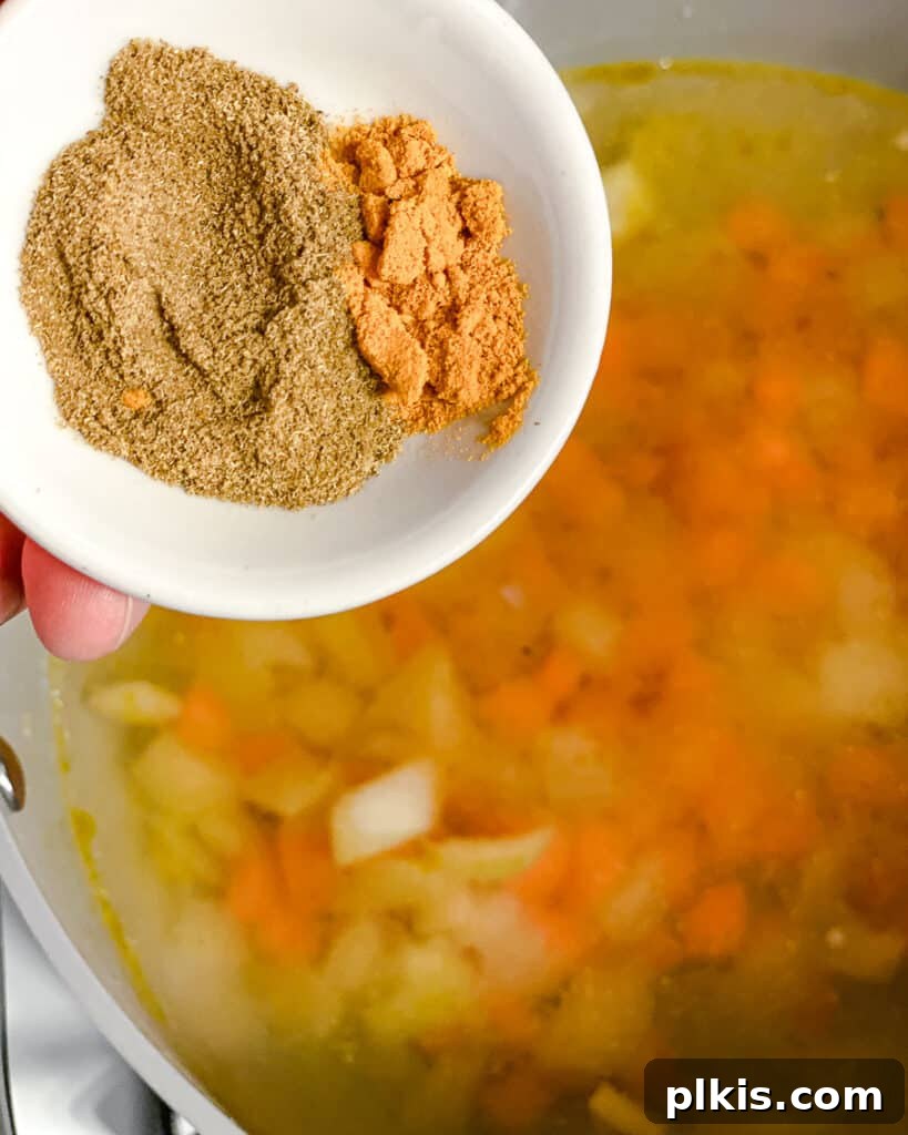 Golden Lentil and Carrot Delight 9 process shot of seasonings being added to pot