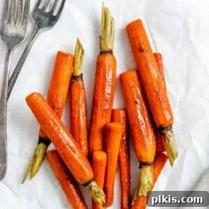Mastering Glazed Carrots and Their Delicious Flavor Variations 12 Completed glazed carrots in a serving bowl against a white surface, showcasing their delicious appeal.