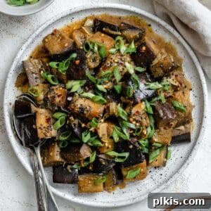 Golden Sautéed Eggplant with Maple Soy Glaze 17 Completed Perfect Sautéed Eggplant plated on a plate against a white background