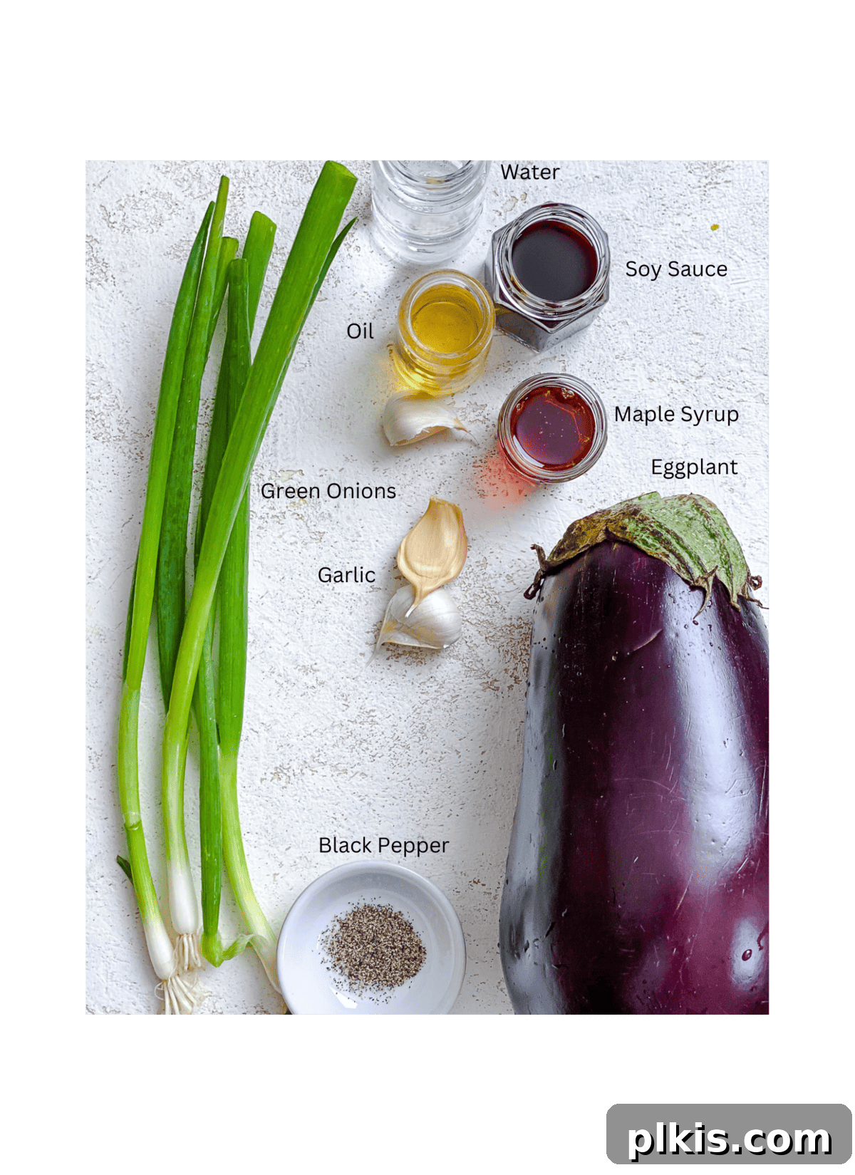 Golden Sautéed Eggplant with Maple Soy Glaze 3 Ingredients for Sautéed Eggplant measured out against a white surface