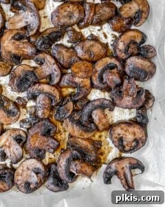 freshly roasted mushrooms on a baking sheet, golden brown and tender
