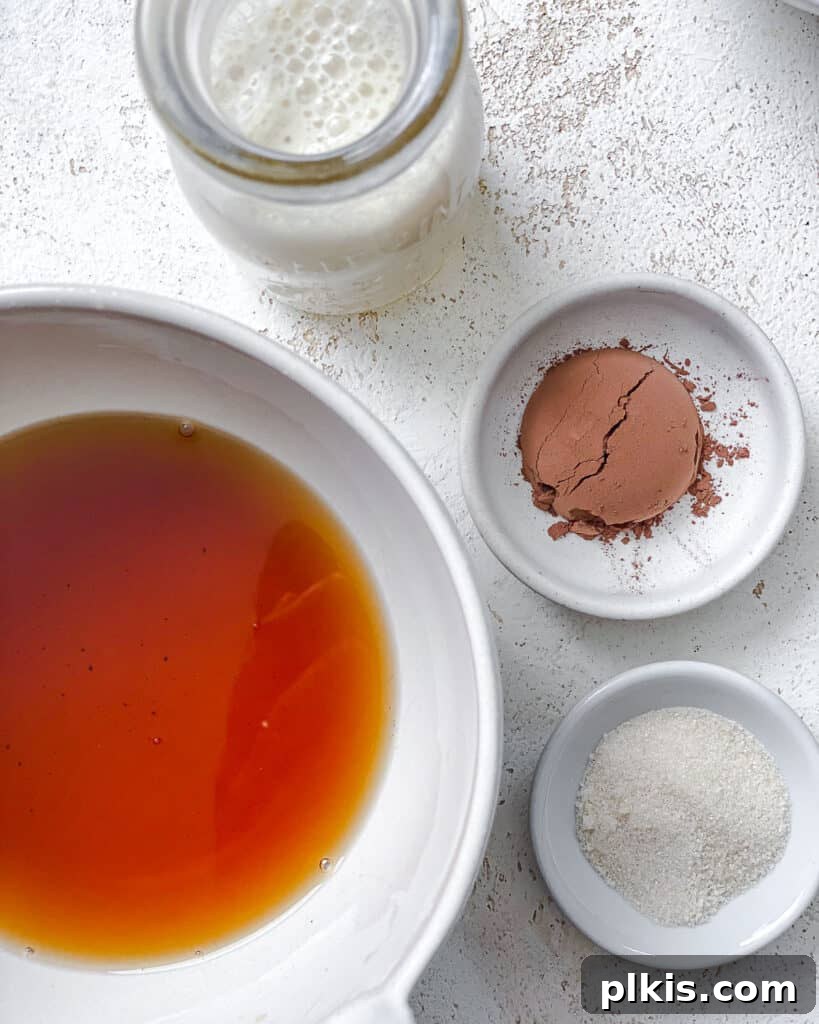 Velvet Chocolate Tea 5 Individual ingredients for Chocolate Milk Tea laid out on a white background before mixing.