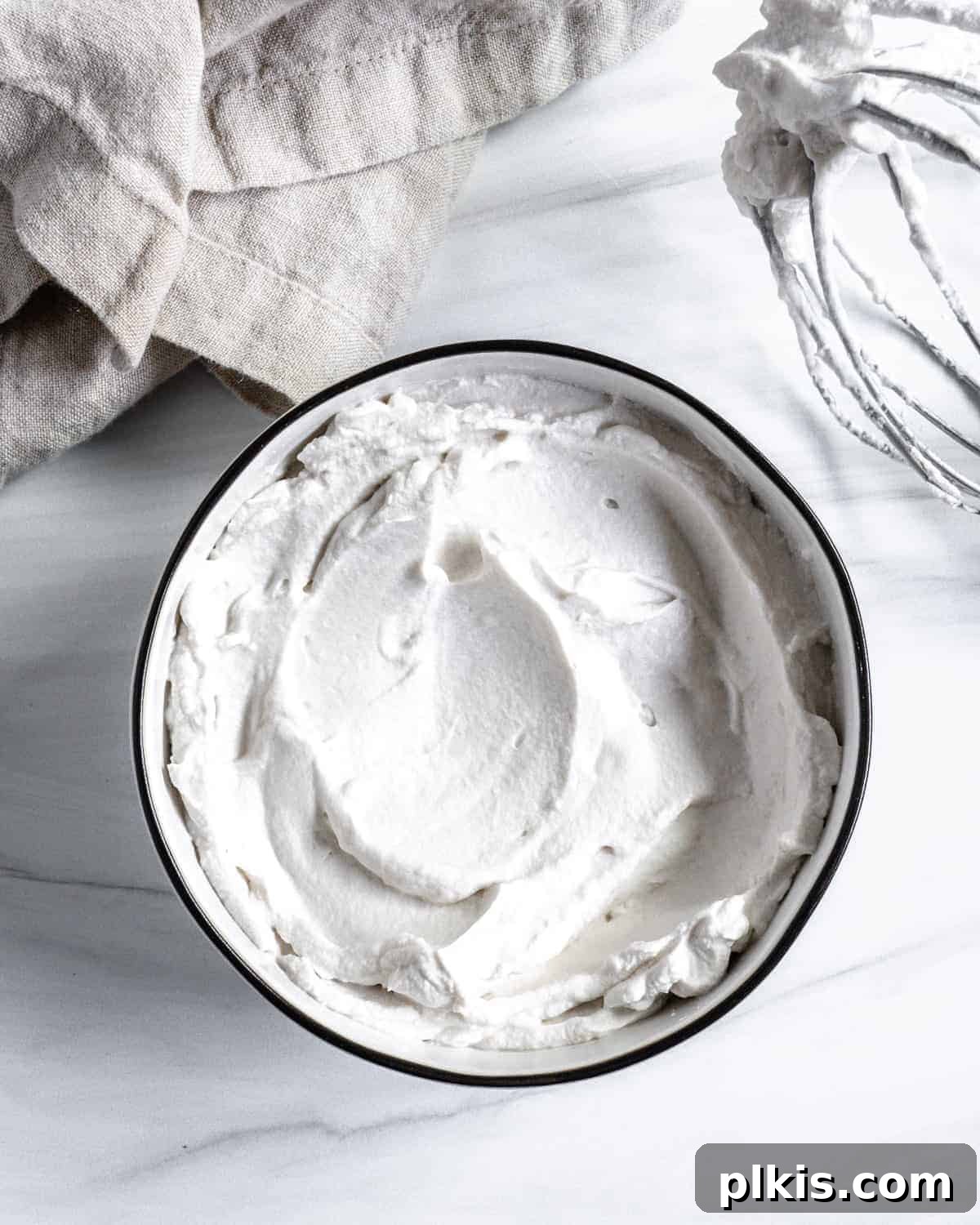 Plant-Based Whipped Topping 6 completed vegan whipped cream with mixing bowl against white background, ready to be served or stored
