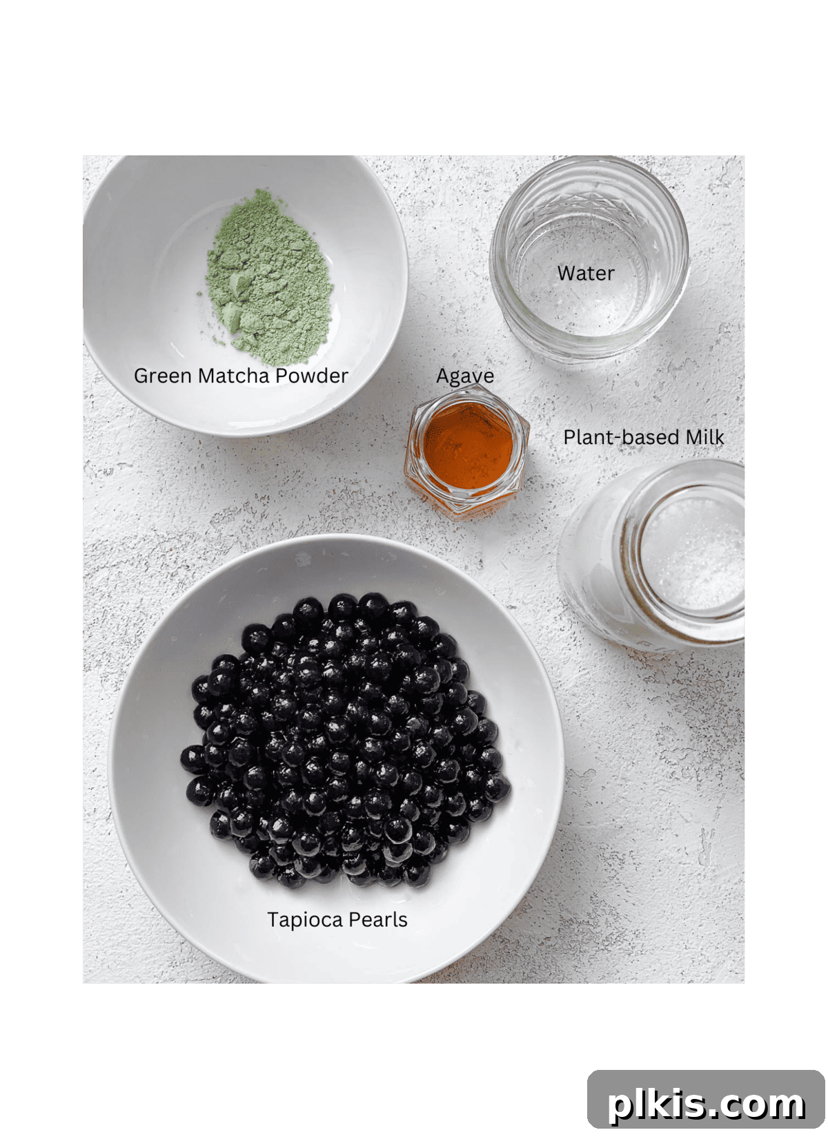 Emerald Creamy Matcha Boba 3 ingredients for Matcha Boba Tea (Green Milk Tea) measured out against a white surface