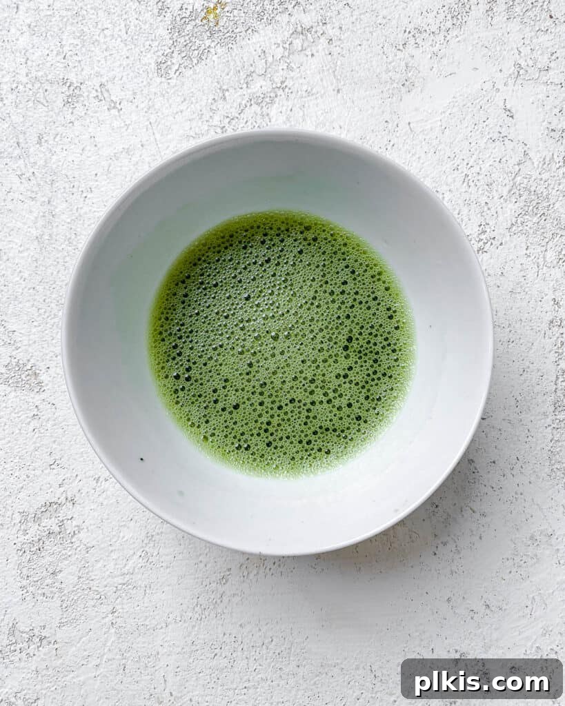 Emerald Creamy Matcha Boba 5 process shot of mixing matcha powder together in a bowl for green milk tea