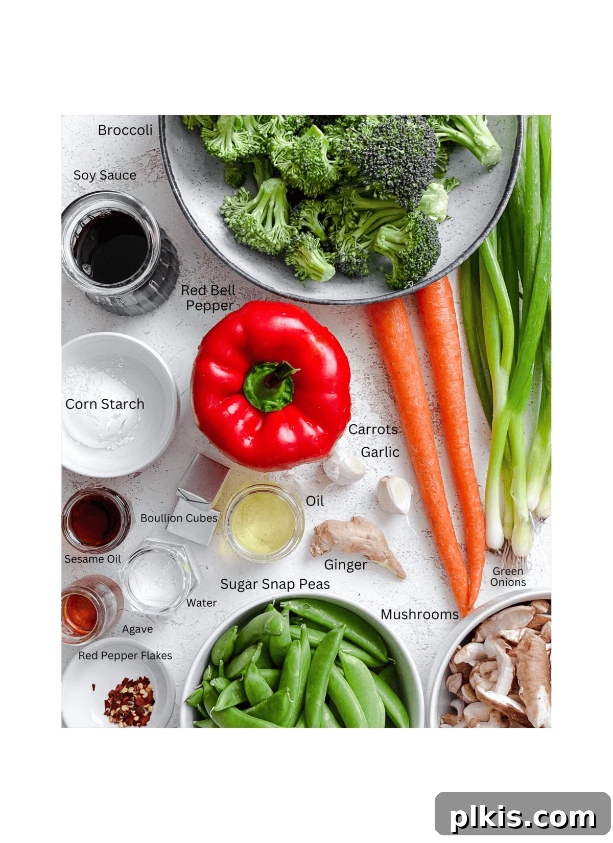 A curated selection of fresh ingredients for Easy Stir-Fry Vegetables, neatly measured and arranged on a white surface, ready for preparation.