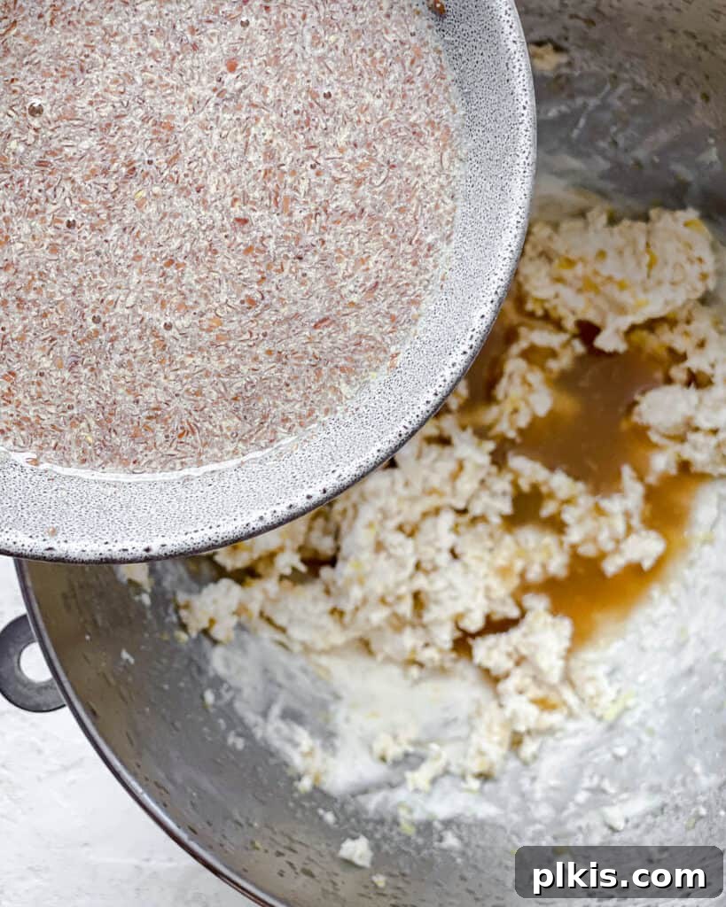 Zesty Vegan Lemon Shortbread 11 Process shot of adding the prepared flaxseed mixture to the wet ingredients in the bowl.