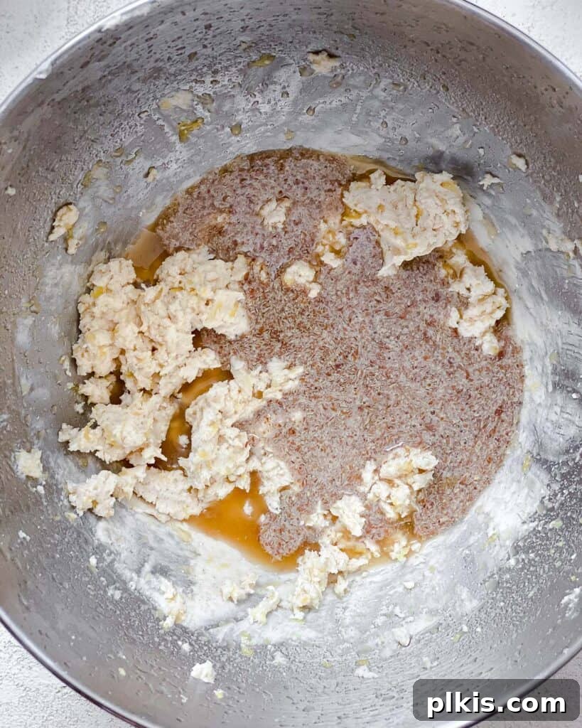 Zesty Vegan Lemon Shortbread 12 Process shot of thoroughly mixing all the wet ingredients together in the bowl until smooth.