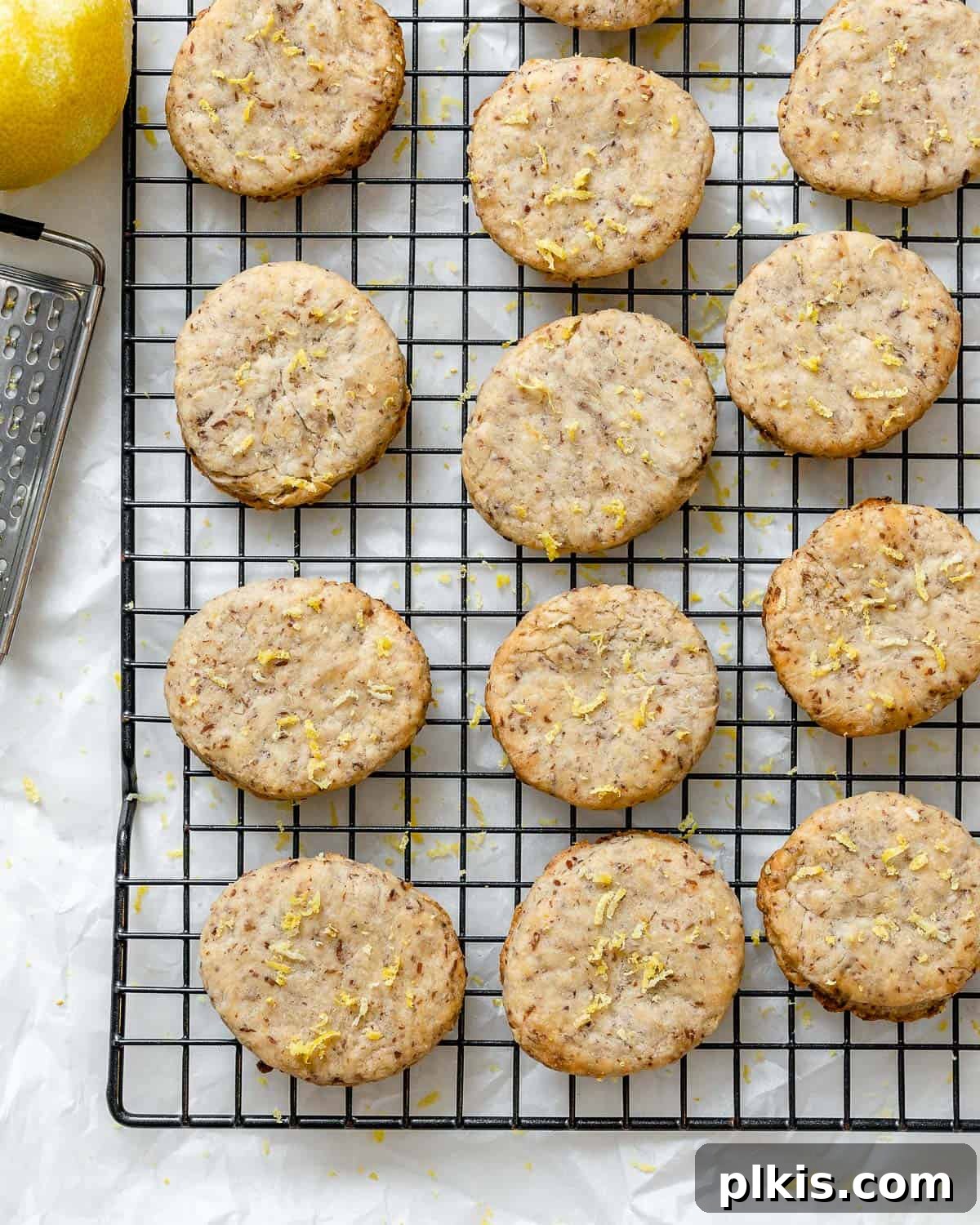 Zesty Vegan Lemon Shortbread 21 Completed Vegan Lemon Shortbread Cookies arranged neatly on a wire cooling rack, ready to be enjoyed.