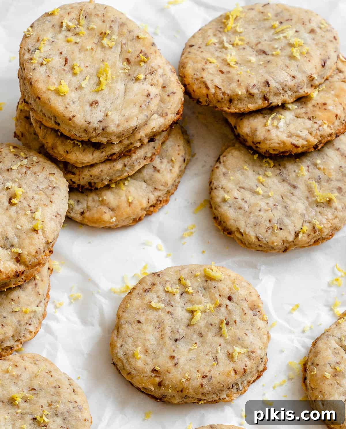 Zesty Vegan Lemon Shortbread 22 A vibrant display of completed Vegan Lemon Shortbread Cookies scattered artfully on a white surface, ready to be enjoyed.