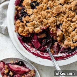 Warm Apple Blueberry Crumble 16 completed Apple and Blueberry Crumble against a light background