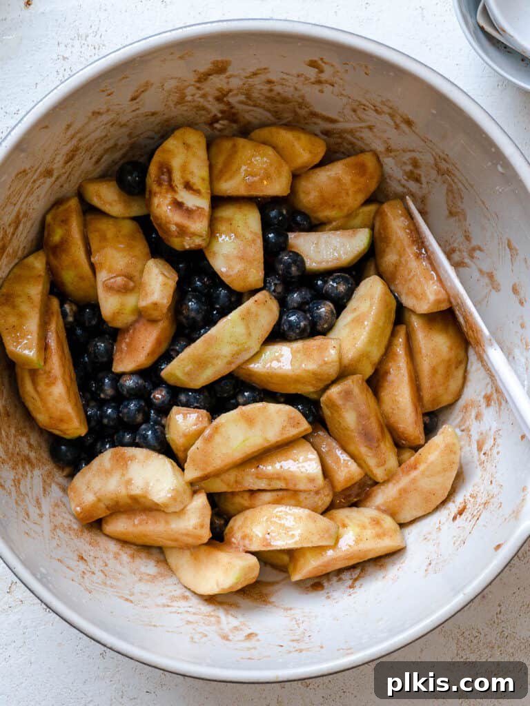 Warm Apple Blueberry Crumble 9 process shot of mixing filling mixture together