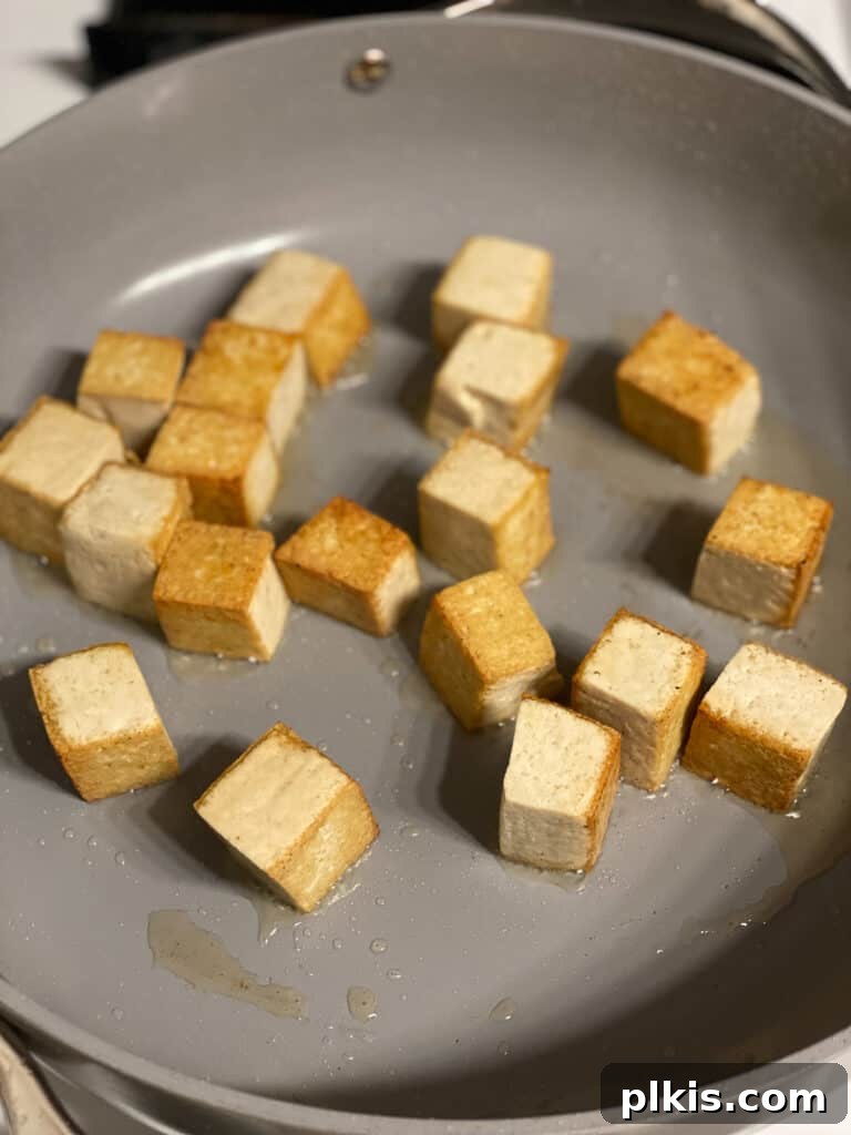 Speedy Teriyaki Tofu Bowl 4 Process shot of tofu cooking in pan until golden brown