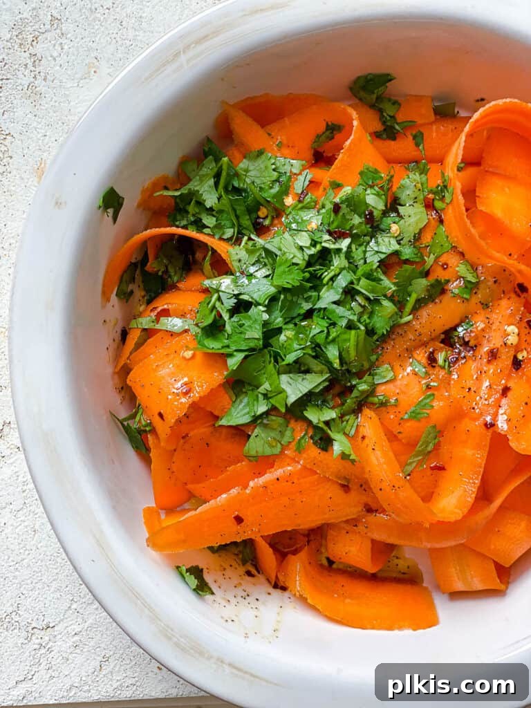 Vibrant Carrot Salad 9 post process of adding dressing to carrot salad