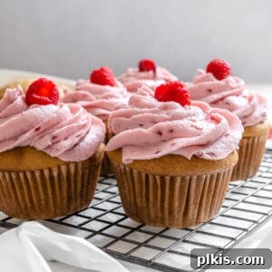 Simple Raspberry Cupcakes Your Way 13 completed raspberry cupcakes on wire rack
