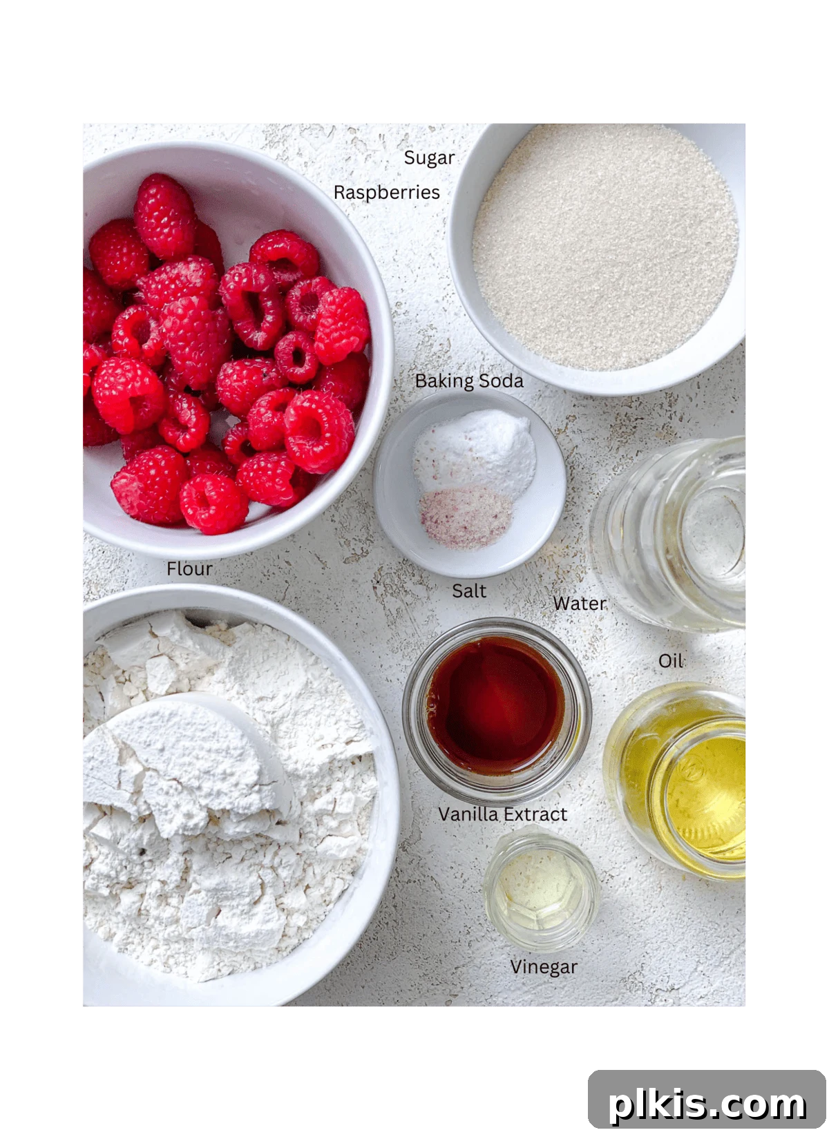 ingredients for Easy Raspberry Cupcakes [+ Add-Ins] measured out against a white surface