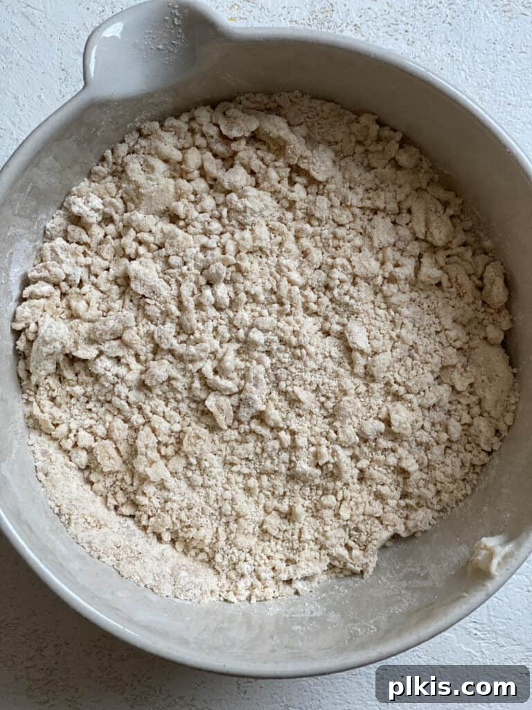Zucchini Apple Pie Surprise 9 Post mixing ingredients for the pie crumb topping in a bowl, showing a perfectly textured crumble.