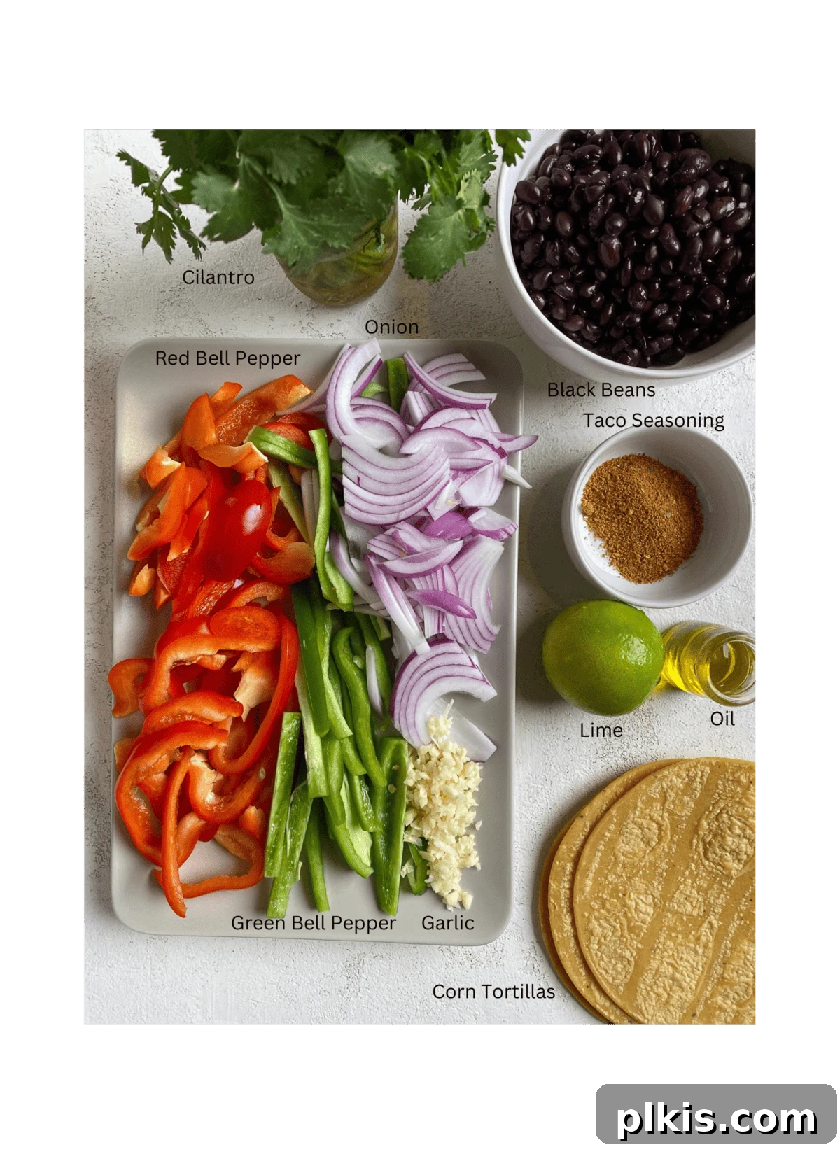 Sizzling Veggie Tacos 3 ingredients for Vegan Fajita Tacos against a white surface