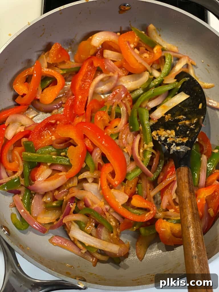 Sizzling Veggie Tacos 6 process of stirring ingredients for Vegan Fajita Tacos in pan