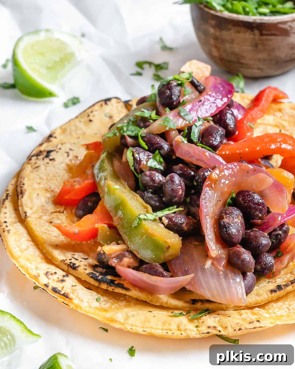Sizzling Veggie Tacos 9 completed Vegan Fajita Tacos against a white surface