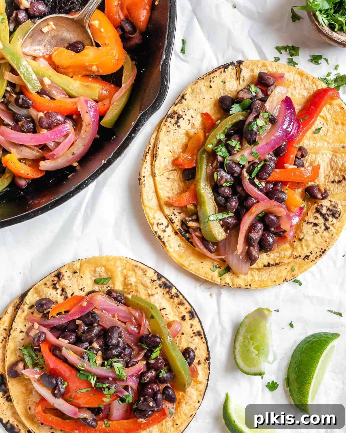 Sizzling Veggie Tacos 10 completed Vegan Fajita Tacos against a white surface