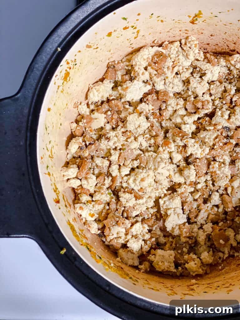 Hearty Vegan Ragu 11 Process shot of tofu and tempeh browning together in the pot, acquiring a desirable texture.