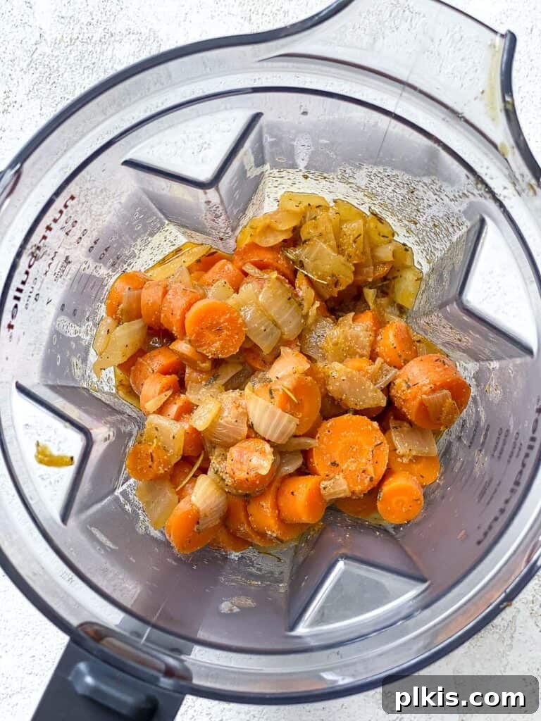 Simple Golden Carrot Sauce 11 process shot showing addition of ingredients in blender