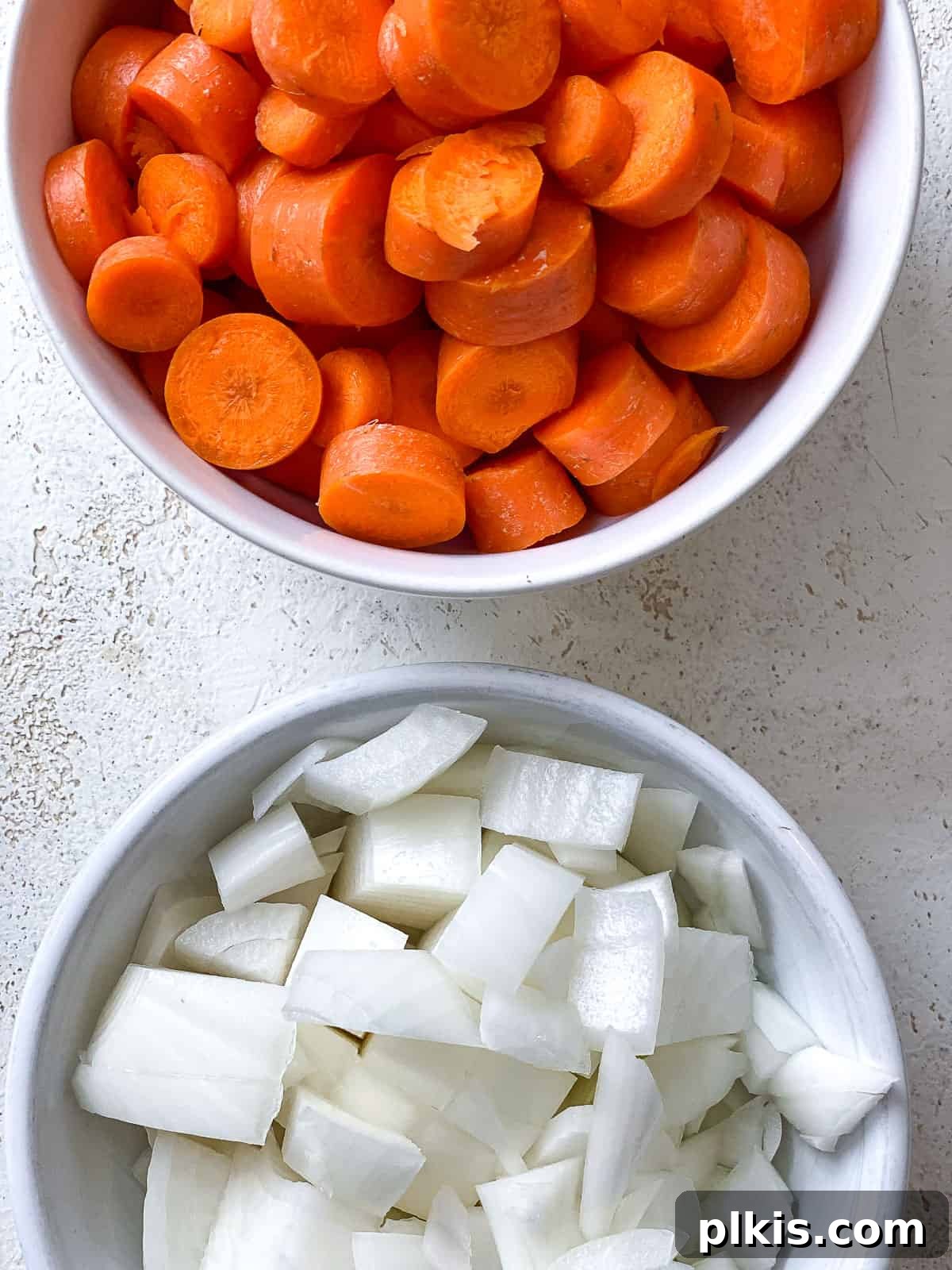 Simple Golden Carrot Sauce 4 ingredients for Easy Carrot Pasta Sauce measured out against a white surface