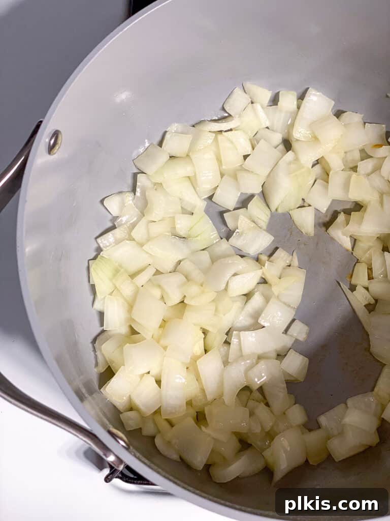 Simple Golden Carrot Sauce 5 process shot of onions cooking in pan