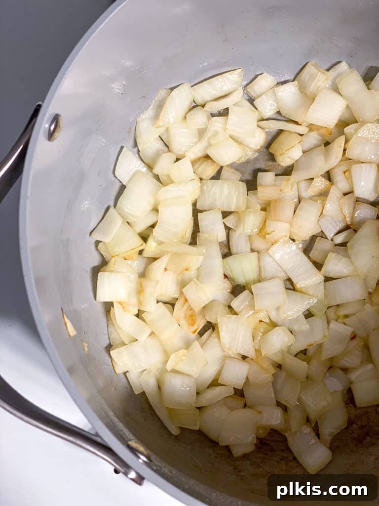 Simple Golden Carrot Sauce 6 process shot of onions cooking in pan