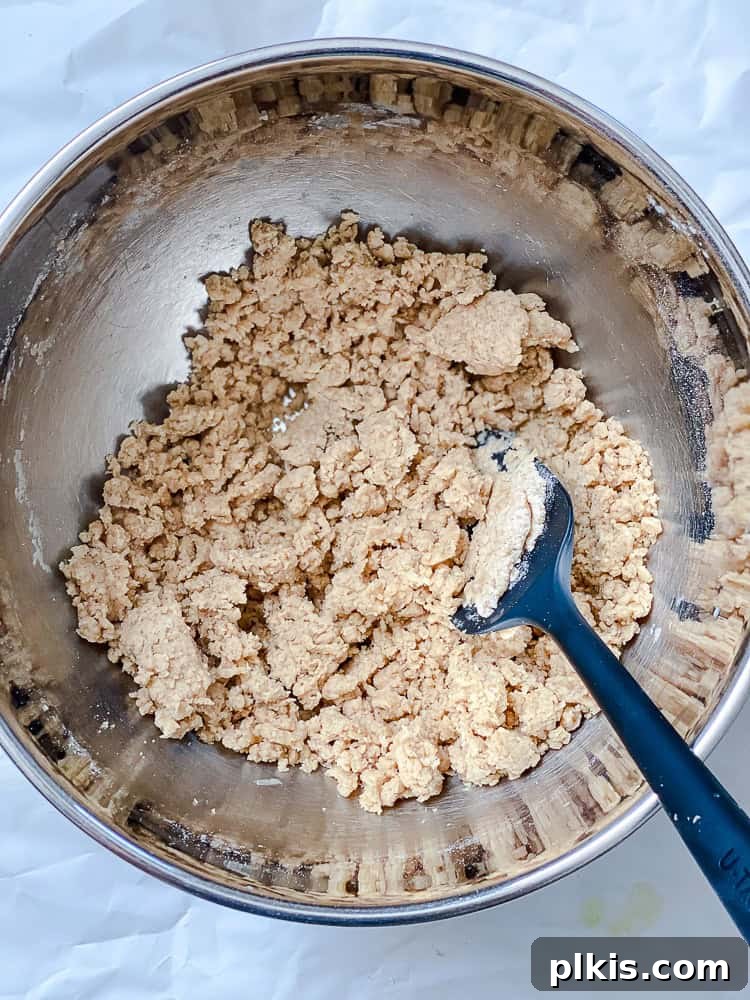 Effortless Vegan Peach Cobbler 8 Process shot showing hot plant-based milk being added to the flour and butter mixture for the topping.