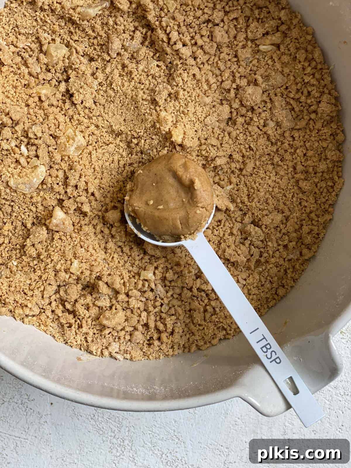 Bold Triple Ginger Vegan Snaps 11 Process shot demonstrating a small cookie scoop filled with dough.