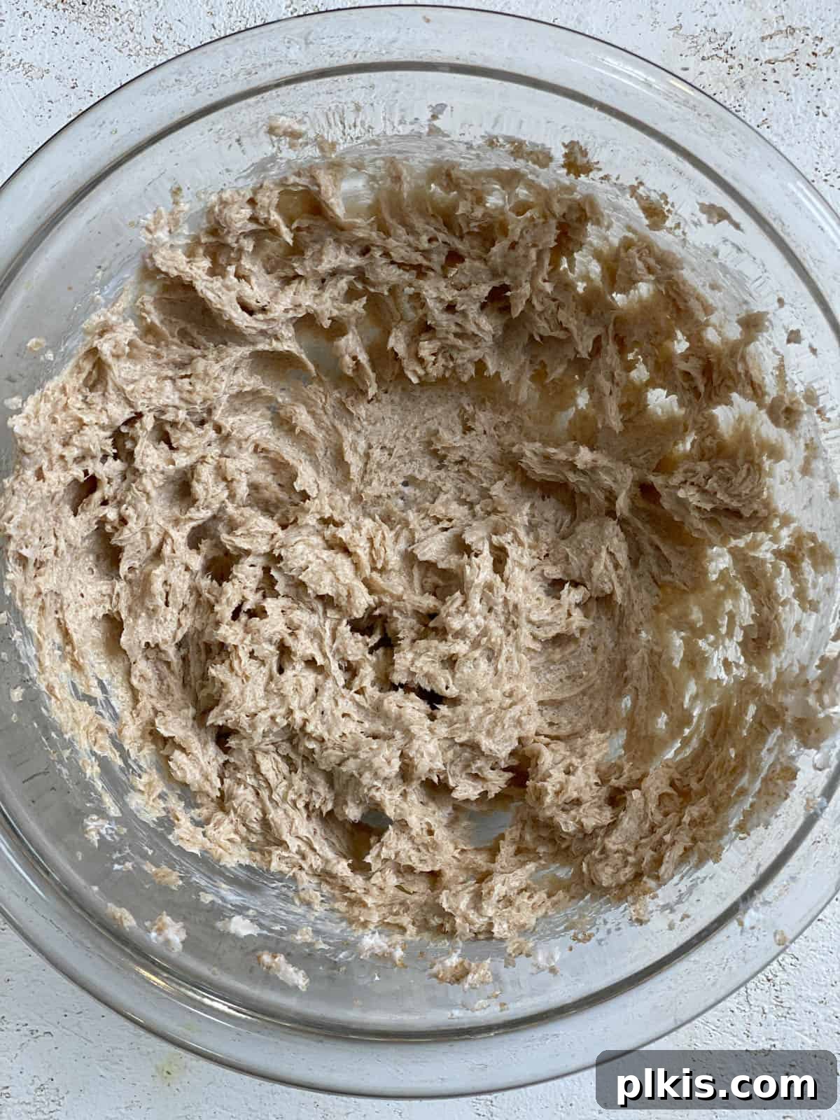 Bold Triple Ginger Vegan Snaps 7 Post-mixing shot of creamed vegan butter and brown sugar, light and fluffy in a bowl.