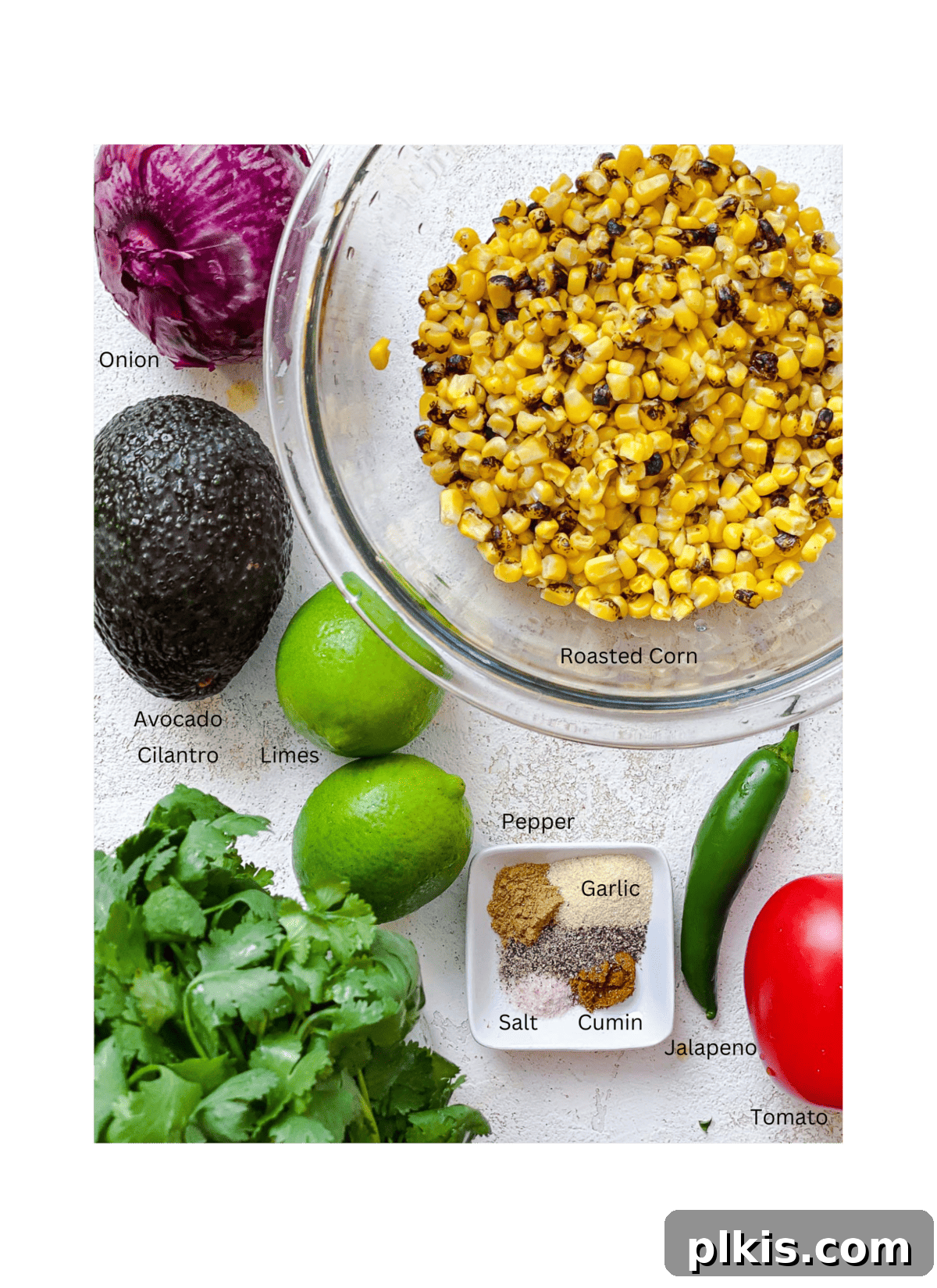 ingredients for Roasted Chili Corn Salsa measured out against a white surface
