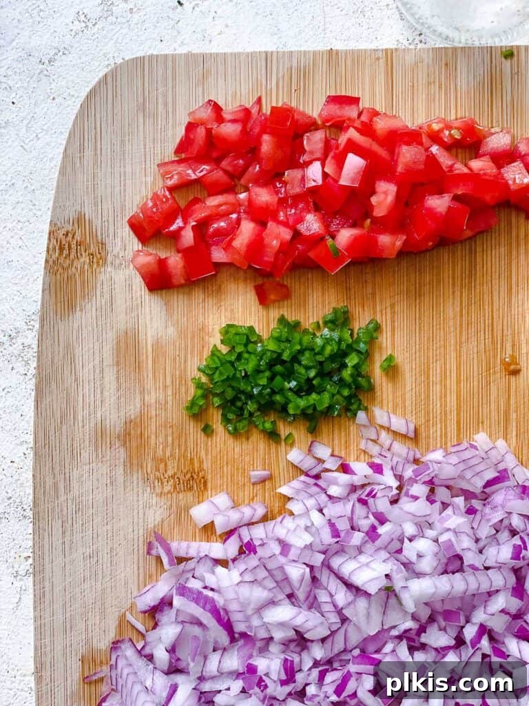 diced veggies against a cutting board