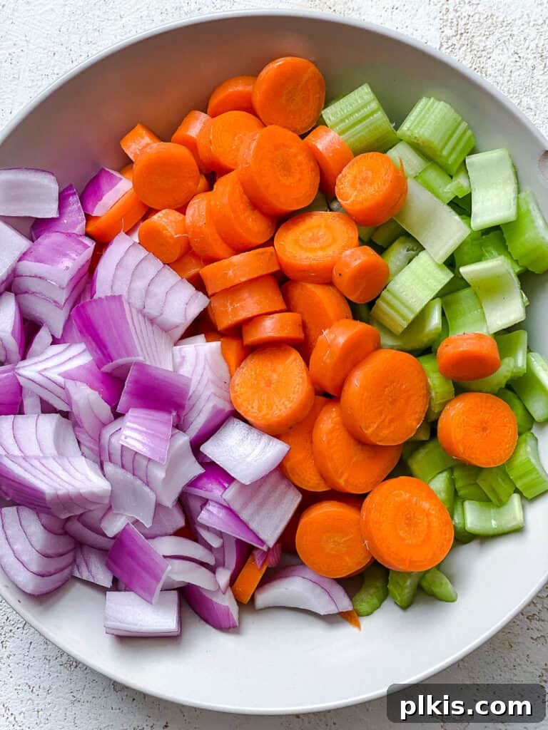 Hearty Eggplant, Tomato, and Chickpea Stew 5 A bowl of sliced onion, celery, and carrots, prepped for the stew.