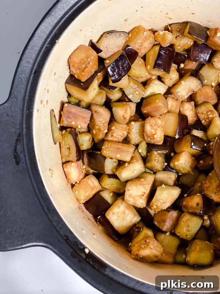Hearty Eggplant, Tomato, and Chickpea Stew 7 Eggplant browning and softening in the pot.