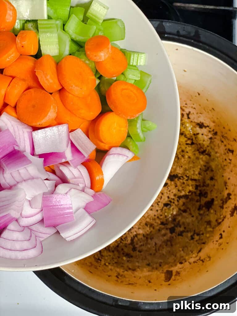 Hearty Eggplant, Tomato, and Chickpea Stew 8 Onion, garlic, celery, and carrots sautéing in the pot.