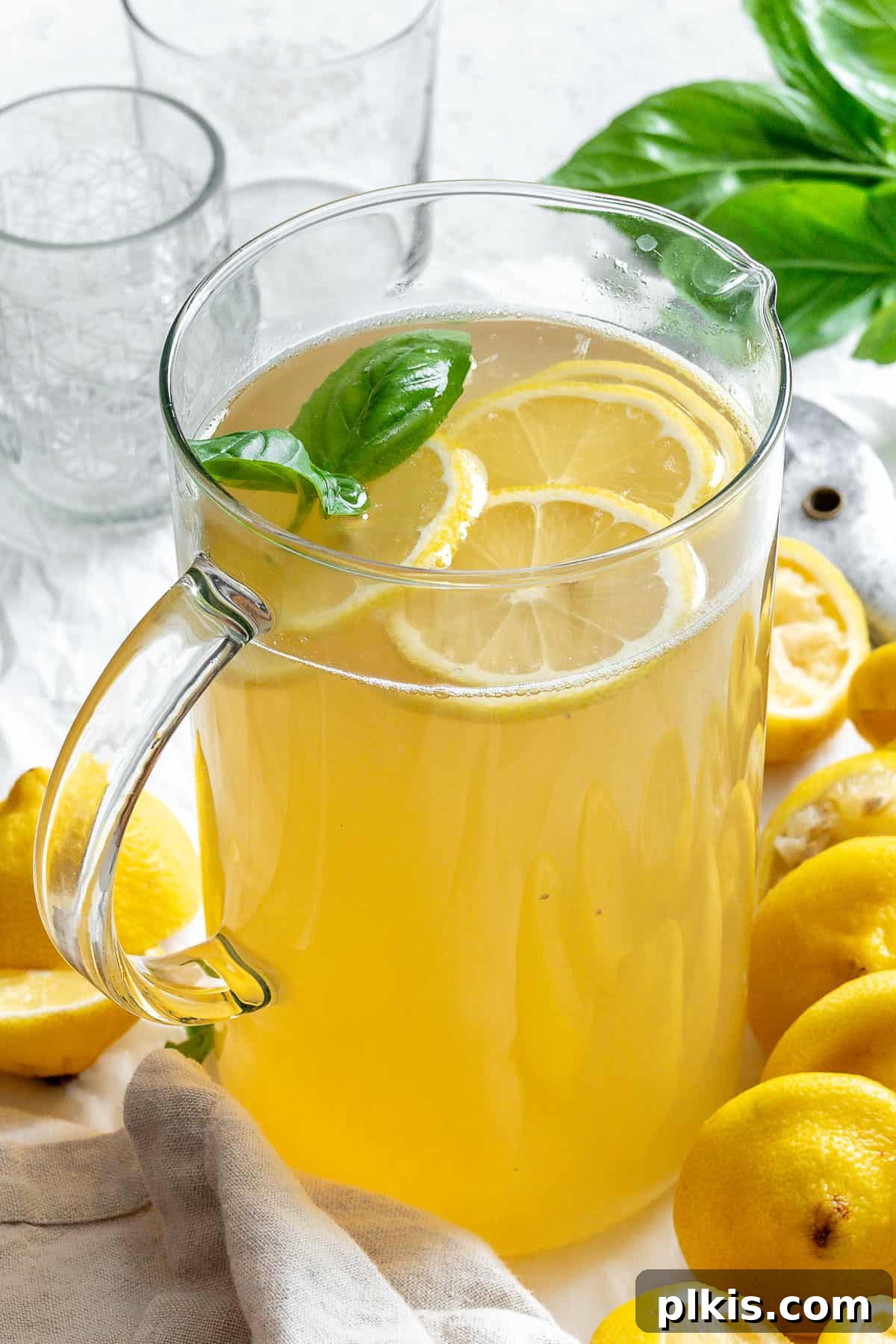 Basil Lemonade Creative Infusions 12 A refreshing glass of basil lemonade with fresh basil leaves and lemon slices, ready to be enjoyed.