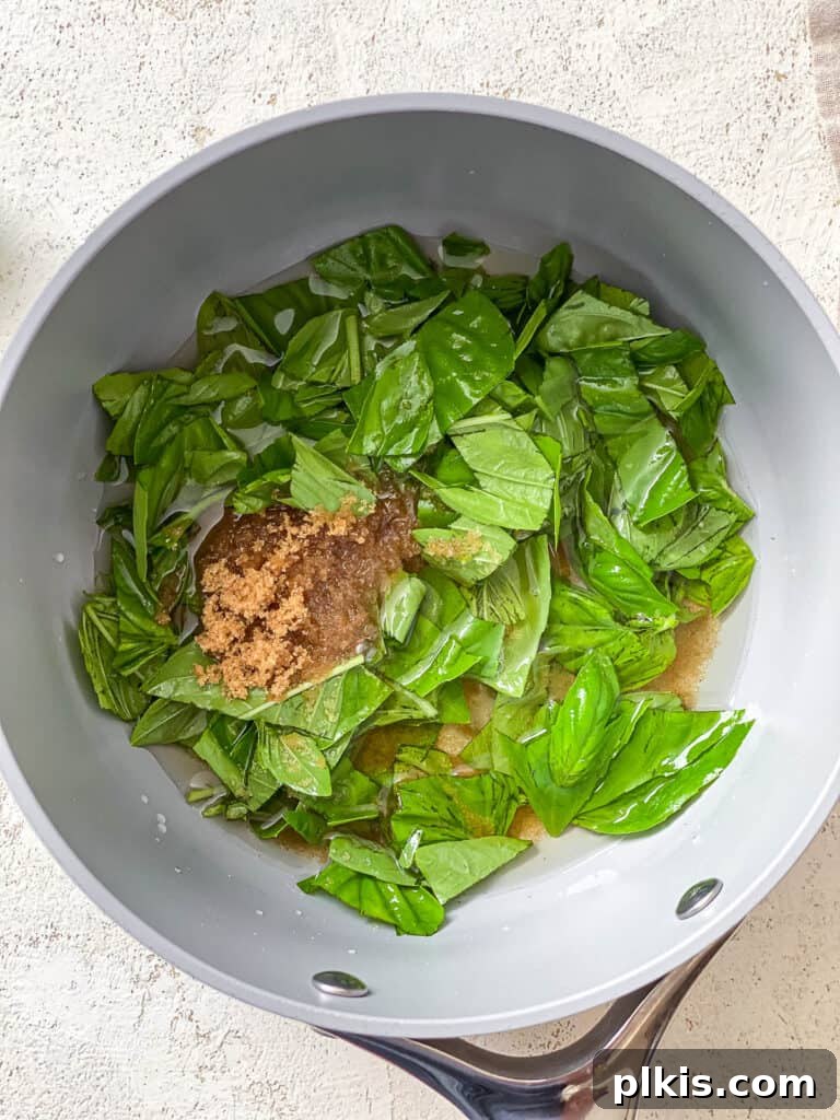 Basil Lemonade Creative Infusions 6 Process shot of sugar, basil, and water heating in a pot to create simple syrup.
