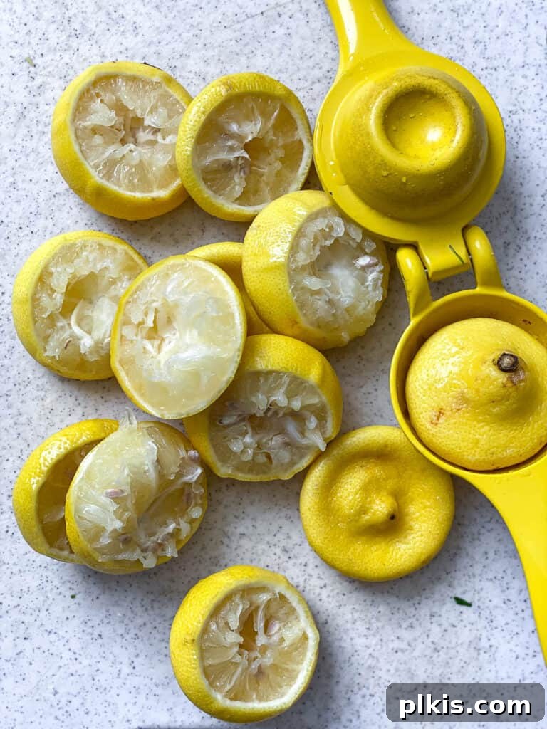 Basil Lemonade Creative Infusions 9 More sliced lemons on a white surface, highlighting their freshness.