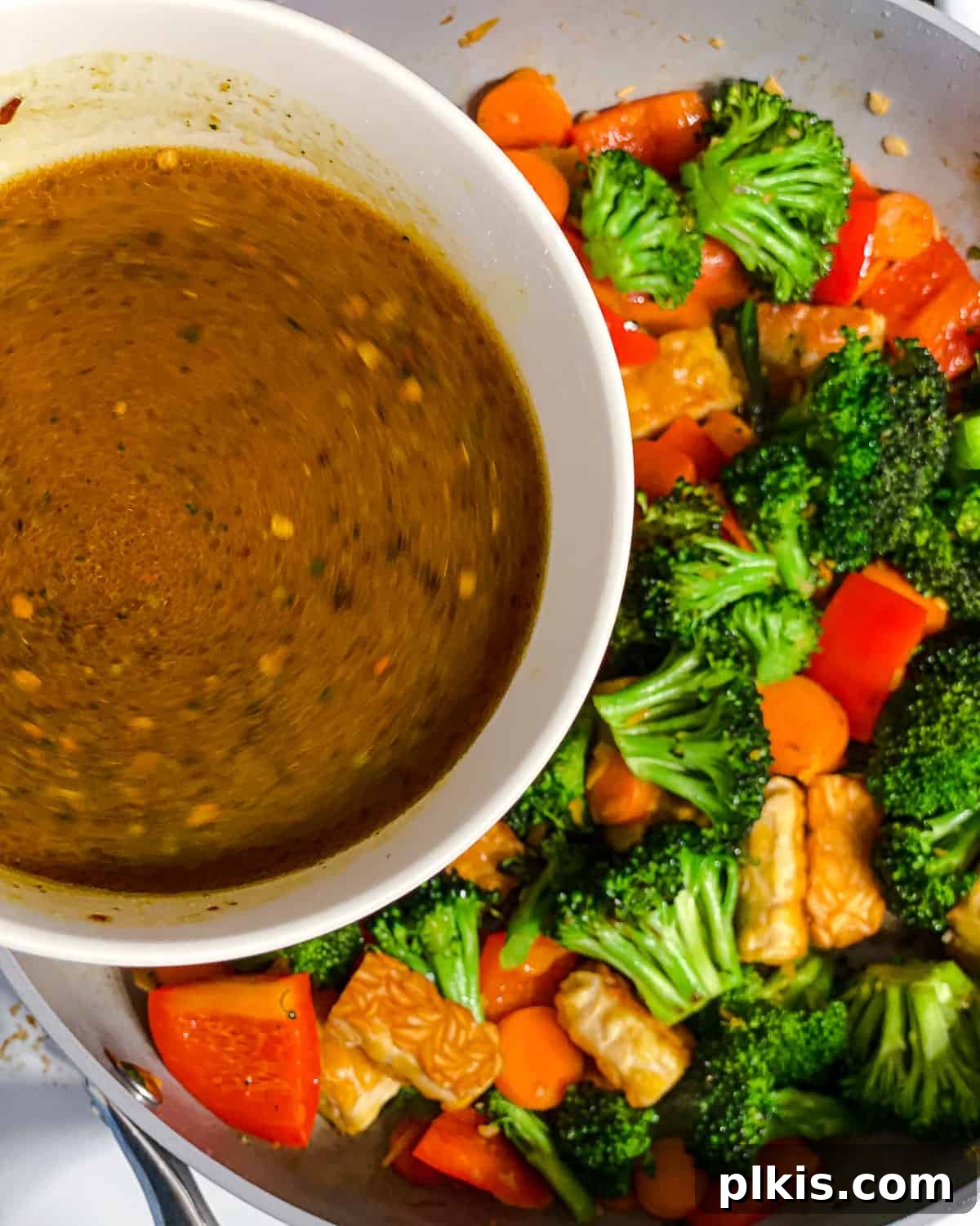 Simple Sizzling Tempeh 8 process shot of adding sauce to pan