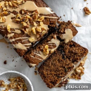 Completed Coffee and Walnut Loaf Cake against a white surface