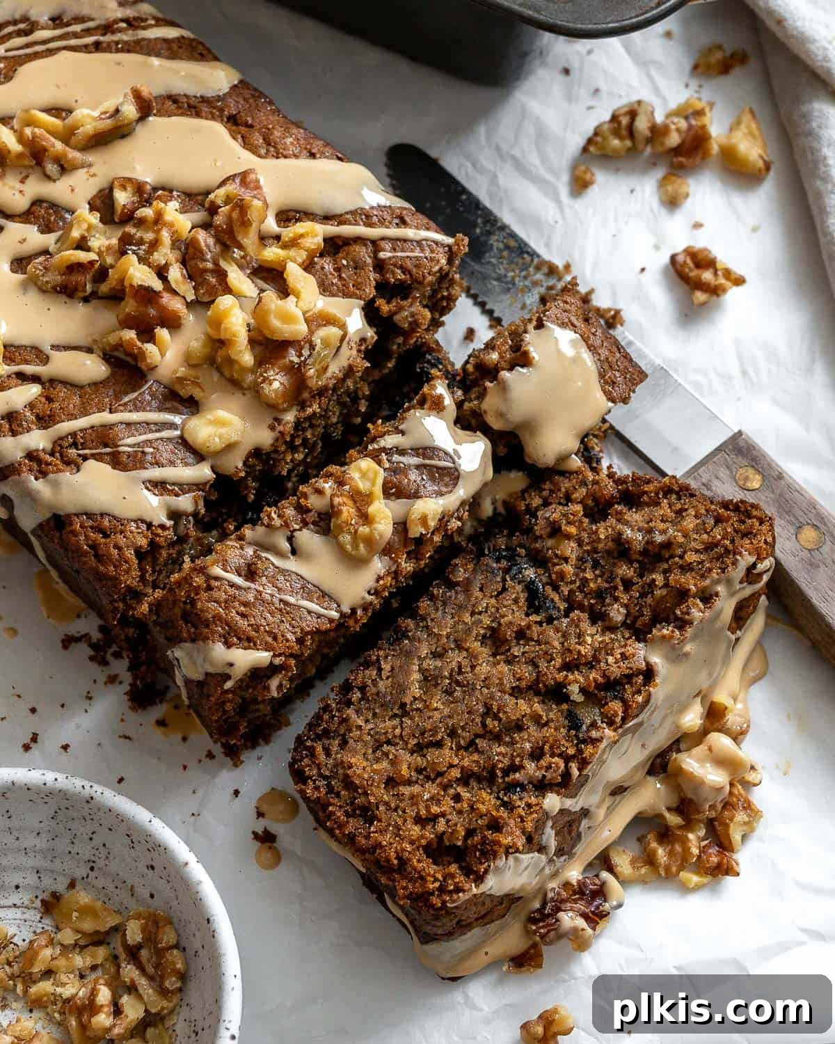 Moist Coffee Walnut Loaf 9 A final close-up shot of the glazed vegan coffee and walnut loaf cake, showcasing its texture and delicious topping.