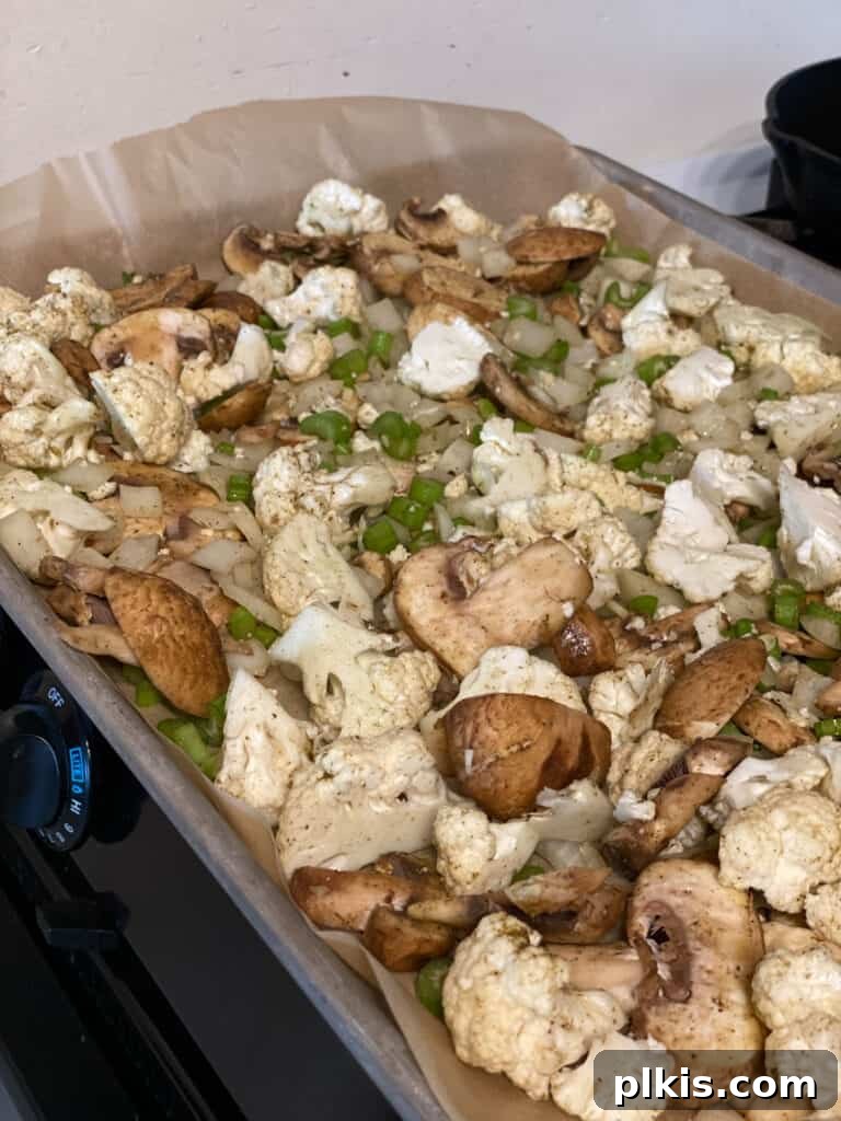 Irresistible Cauliflower Stuffing 5 process shot showing ingredients added to baking dish