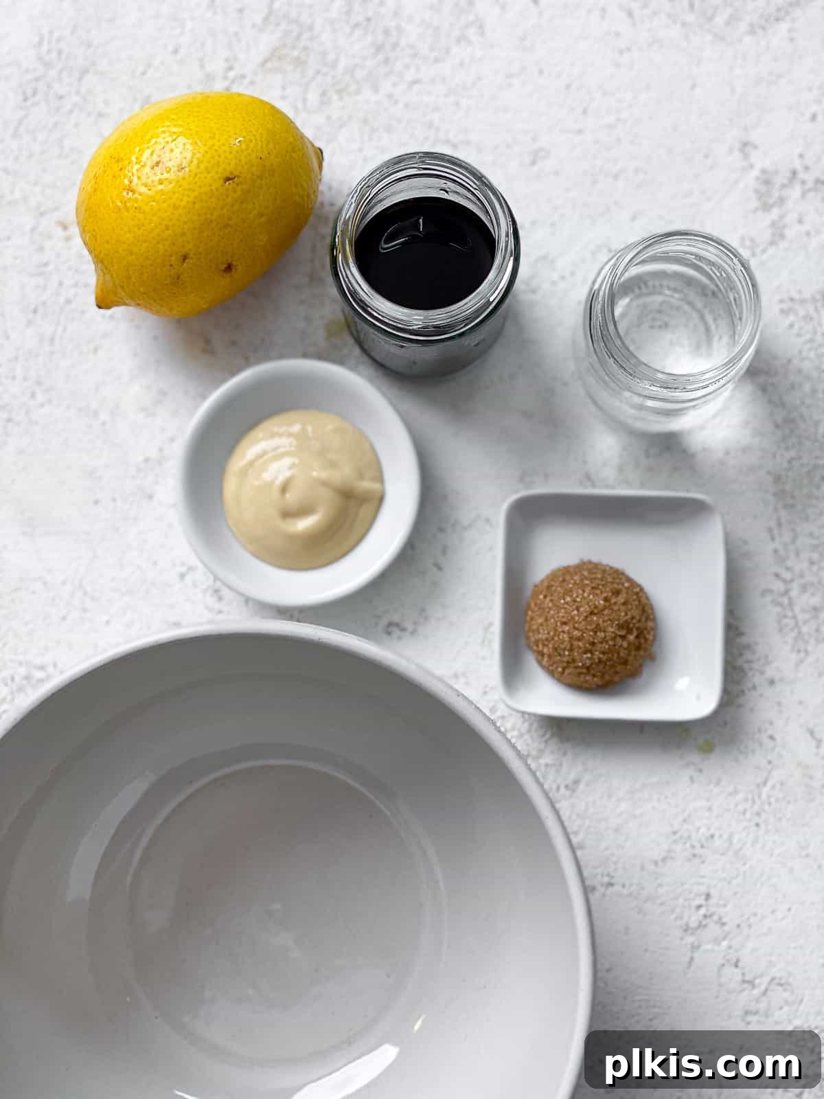 ingredients for 2-Minute Oil Free Salad Dressing [Balsamic Vinaigrette] measured out against a white surface