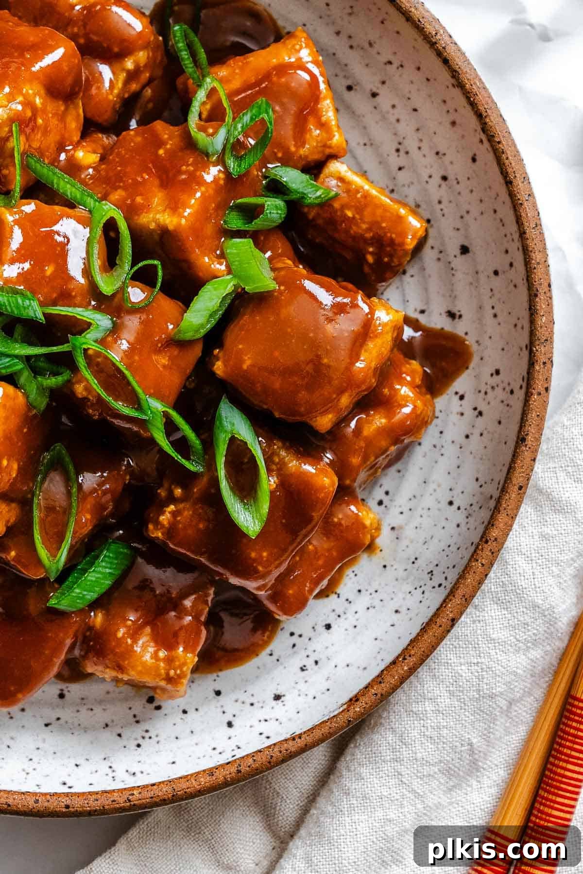 Golden Crispy Tofu with Rich Peanut Sauce 2 Completed Crispy Tofu with Peanut Sauce on a plate.
