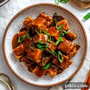Completed Crispy Tofu with Peanut Sauce on a plate.