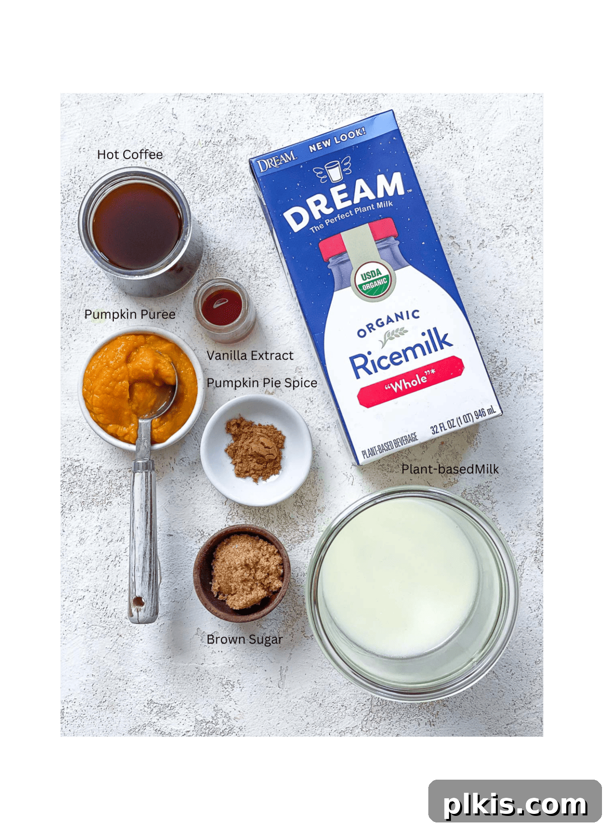 The Ultimate Plant-Based Pumpkin Spice Latte 3 All the vibrant, wholesome ingredients meticulously laid out for crafting a delicious vegan pumpkin spice latte. From rich plant-based milk to aromatic spices and creamy pumpkin puree, each component is ready to be transformed into a cozy beverage.