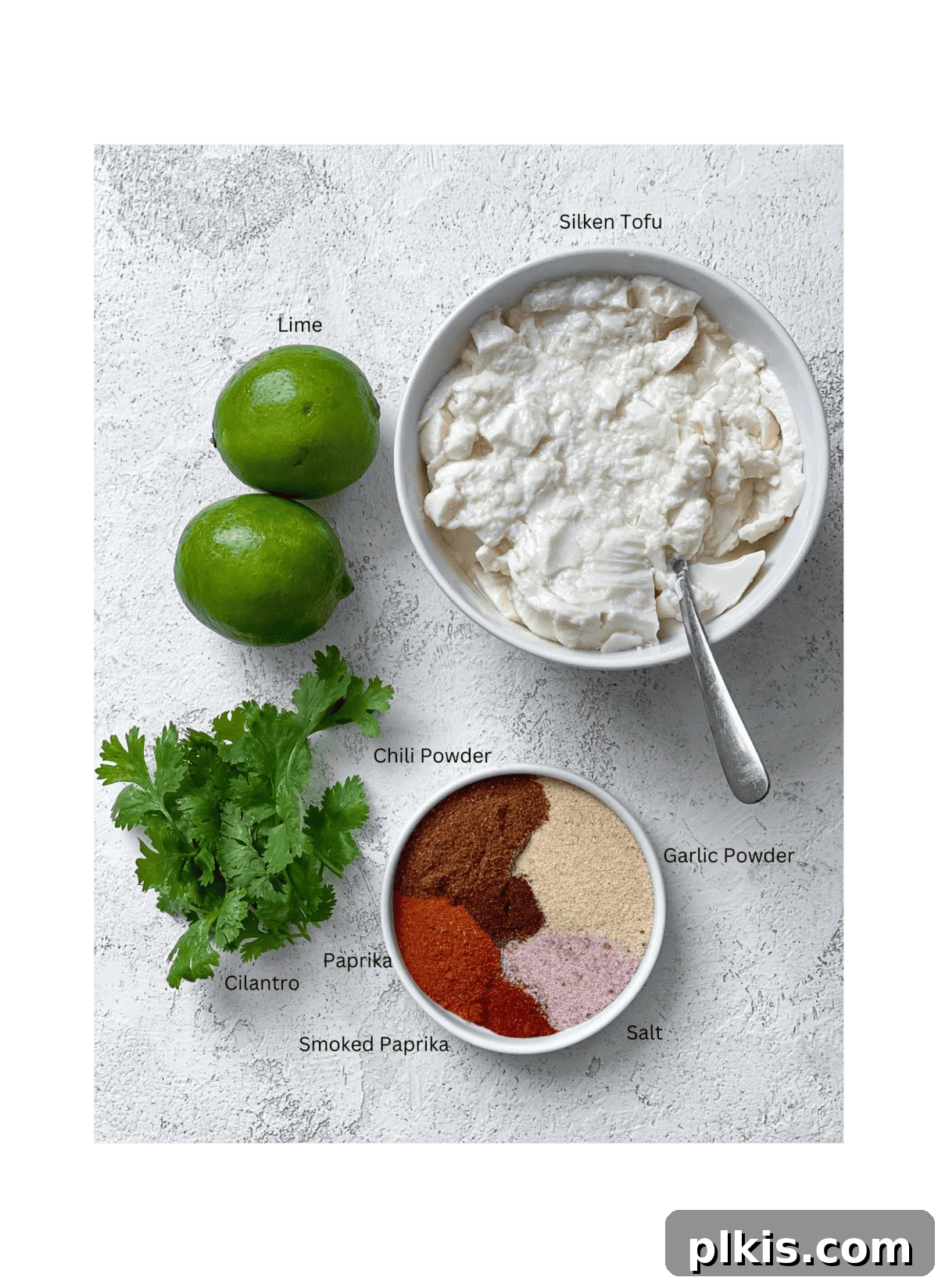 Spicy Vegan Chipotle Taco Dressing 3 Ingredients laid out for Vegan Chipotle Sauce on a white surface